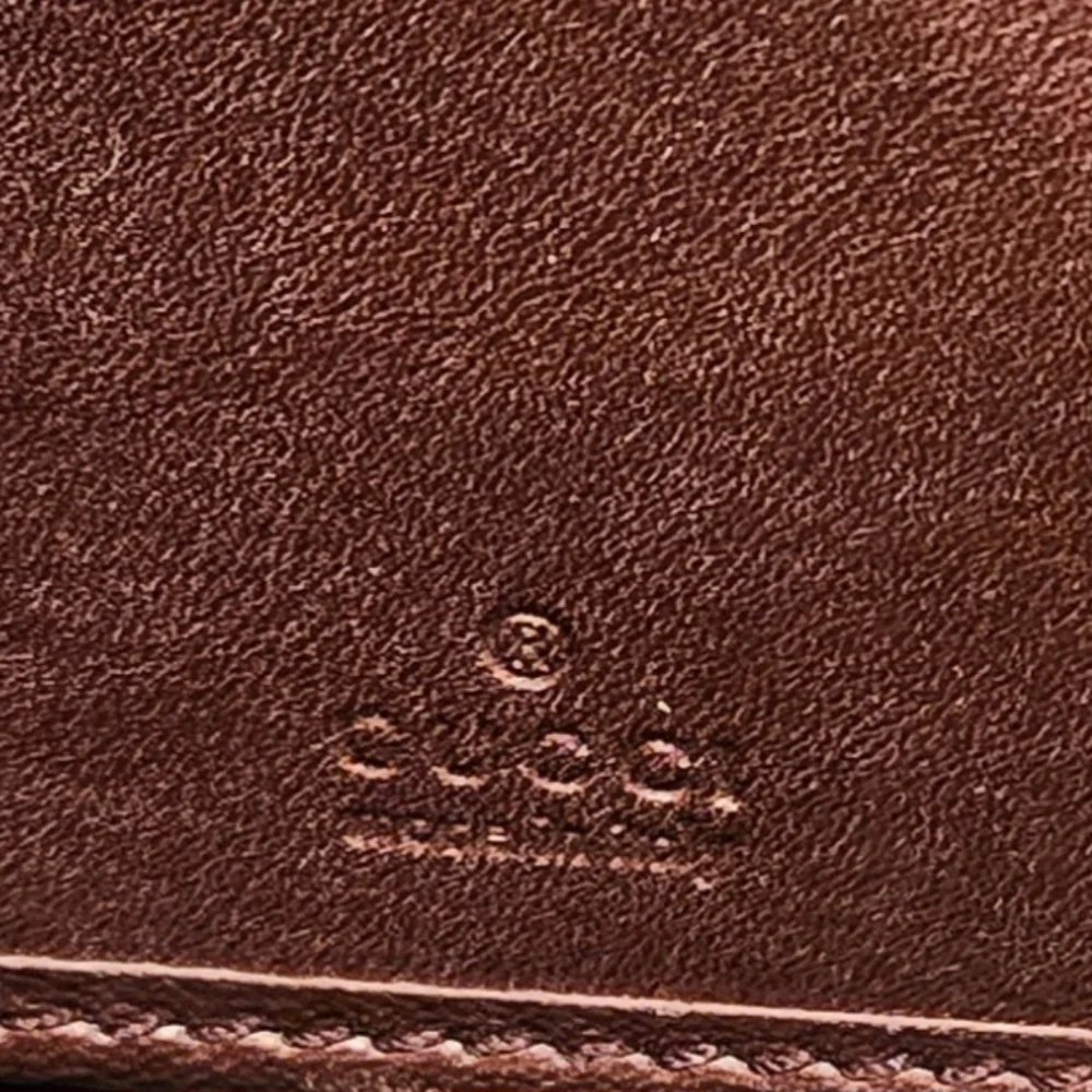 Gucci Guccissima Continental Wallet Interlocking GG Zipper Charm